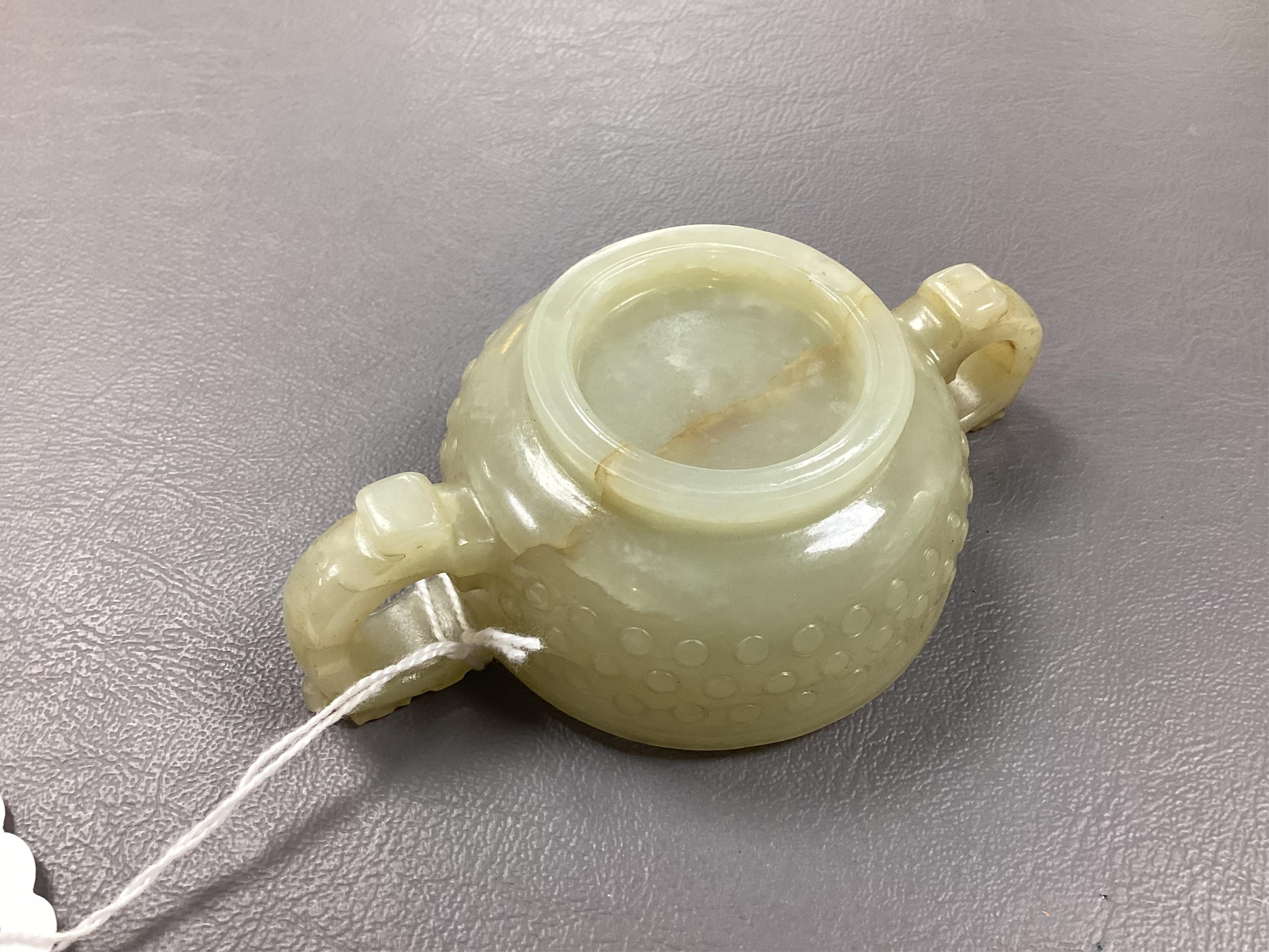 A Chinese pale celadon and russet veined jade cup, 17th century